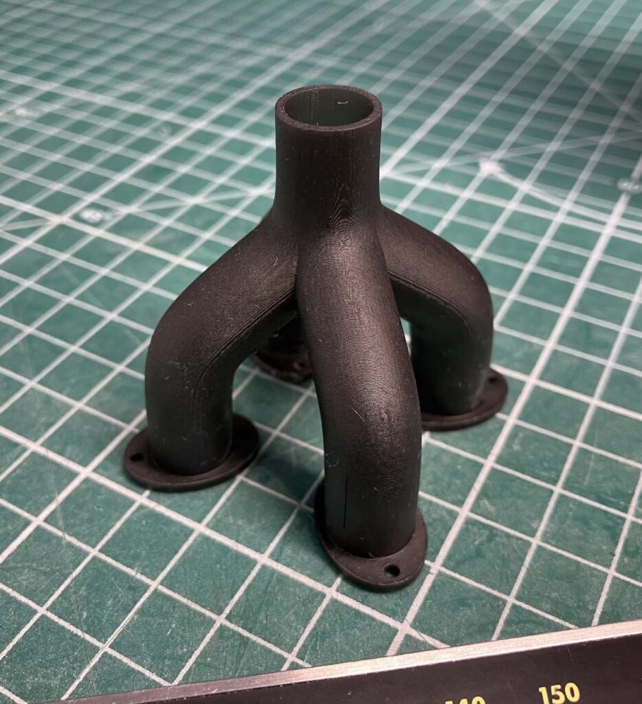 Printed manifold created through custom 3D printing online, showcasing high precision and quality for engineering applications, part of our 3D printing online services.